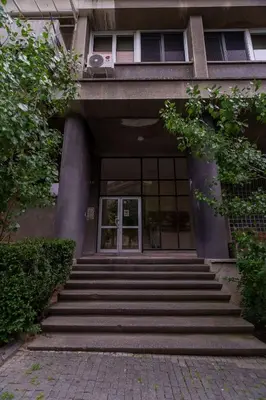 a building with stairs leading up to a door at MaKi apartment in Belgrade