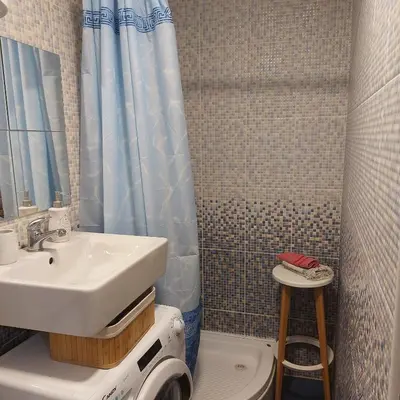 a bathroom with a sink and a toilet at Apartment ADA RB Belgrade in Čukarica