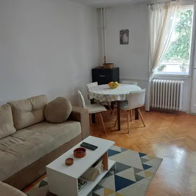 a living room with a couch and a table at Apartment ADA RB Belgrade in Čukarica