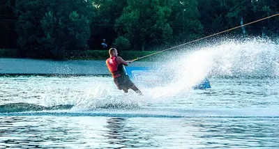 a man is water skiing on a lake at Apartment ADA RB Belgrade in Čukarica