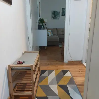 a living room with a couch and a table at Apartment ADA RB Belgrade in Čukarica