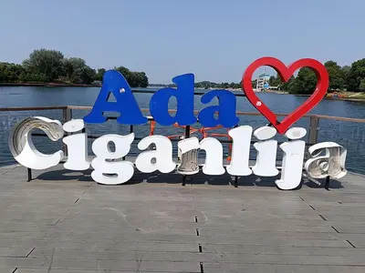 a sign for a beach with a red heart at Apartment ADA RB Belgrade in Čukarica