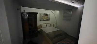 a small bedroom with a small bed in a room at Uno in Belgrade