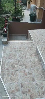 a stone patio with some plants and flowers at Uno in Belgrade