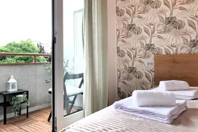 a bedroom with a bed and a wall mural at Downtown nest Apartment in Belgrade