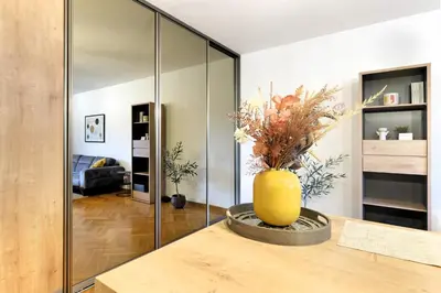 a living room with a yellow vase on a table at Downtown nest Apartment in Belgrade