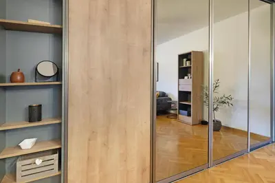 a sliding glass door in a living room at Downtown nest Apartment in Belgrade