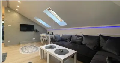a living room with a couch and a table at Due in Belgrade