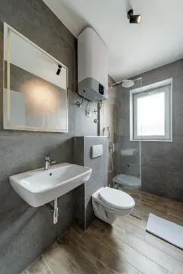 a bathroom with a sink and a toilet at Forty One Suites Belgrade Apartments in Voždovac