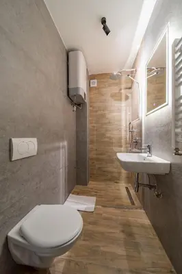 a bathroom with a toilet and a sink at Forty One Suites Belgrade Apartments in Voždovac
