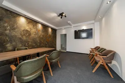 a conference room with a table and chairs at Forty One Suites Belgrade Apartments in Voždovac