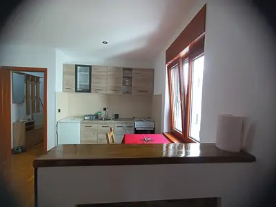 a kitchen with a wooden counter top in a room at Kutak-Corner in Vračar (historical)