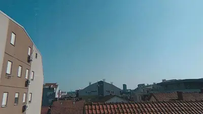 a view of the roofs of buildings in a city at Kutak-Corner in Vračar (historical)