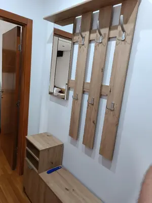 a room with a mirror and a wooden bench at Kutak-Corner in Vračar (historical)