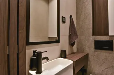a bathroom with a white sink and a mirror at Belgrade City Escape - Genex in Belgrade