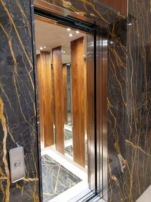 a bathroom with a mirror and a walk in shower at Unique Premium Penthouse with Spa and Gym in Dedinje in Belgrade