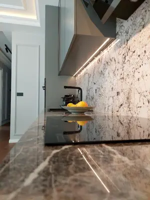 a kitchen with a counter with a plate of fruit on it at Unique Premium Penthouse with Spa and Gym in Dedinje in Belgrade