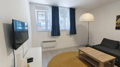 a living room with a couch and a flat screen tv at B sweet home S in Belgrade