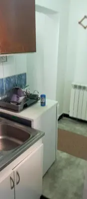 a kitchen with a sink and a counter top at Airport MD Apartment in Belgrade