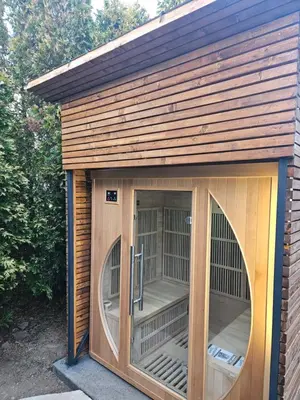 a small dog house with two large windows at Navas River House in Poljane