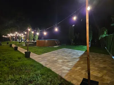 a park at night with a bunch of lights at Navas River House in Poljane