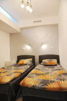 two beds sitting next to each other in a room at 404 Apartment in Belgrade