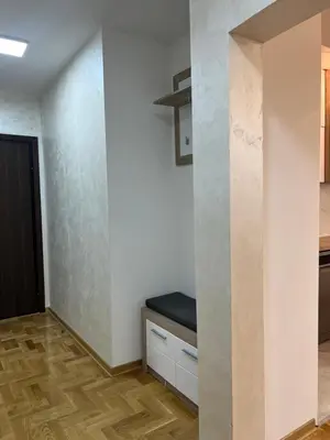 a room with a wall with a bench in it at Stan na dan, Beograd-Žarkovo in Žarkovo