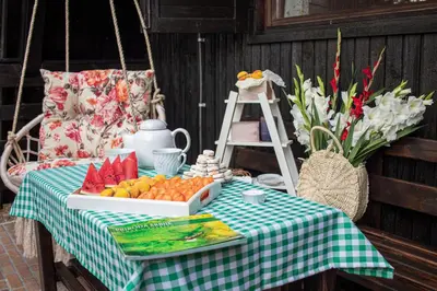 a picnic table with a box of fruit on it at Čajnički katun-čardak in Grabovac