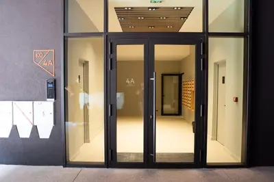 an entrance to a building with glass doors at Apartment - K District Belgrade in Belgrade
