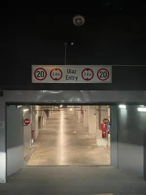a tunnel with signs on the top of a building at Angelina city LUX apartment with garage in Belgrade