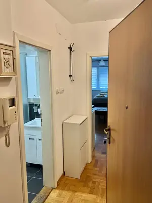 a room with a hallway with a sink and a kitchen at Maison d'Elite in Belgrade