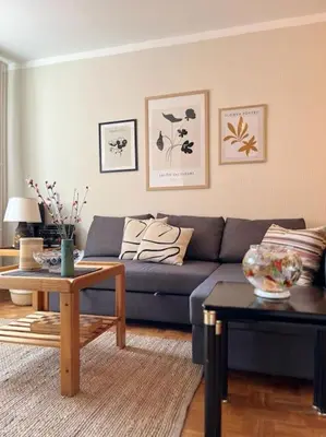a living room with a couch and a table at Lela's Place Vojvode Brane in Belgrade