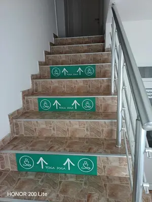 a set of stairs with green signs on them at Udobna Soba Sa Prelepim Pogledom #4 in Mladenovac