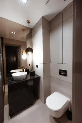 a bathroom with two sinks and a toilet at inJoy in Sajmište