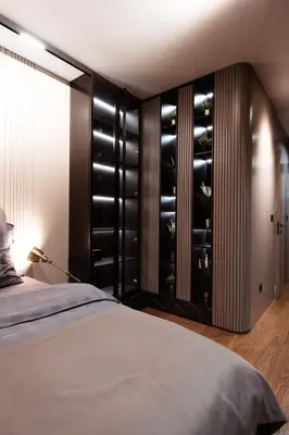 a bedroom with a bed and a wine cellar at inJoy in Sajmište