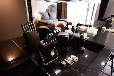 a living room with a table with utensils on it at inJoy in Sajmište