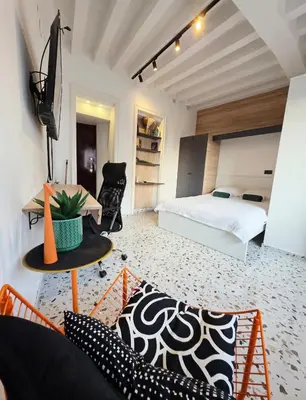 a bedroom with a bed and a desk and a table at Central Studio 531- Pedestrian Zone Belgrade in Belgrade
