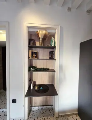 a room with a shelf with a table in it at Central Studio 531- Pedestrian Zone Belgrade in Belgrade