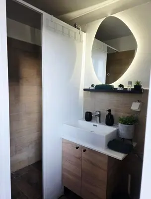 a bathroom with a white sink and a mirror at Central Studio 531- Pedestrian Zone Belgrade in Belgrade
