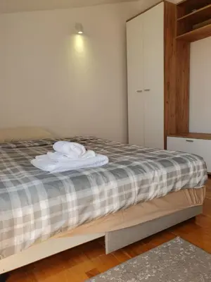 a bedroom with a bed with towels on it at Ada mall-Beograd 2 bedroom in Čukarica