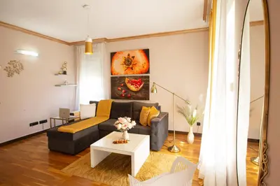 a living room with a couch and a table at Goldy in Belgrade