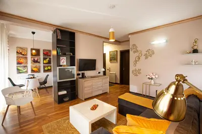 a living room with a couch and a table at Goldy in Belgrade