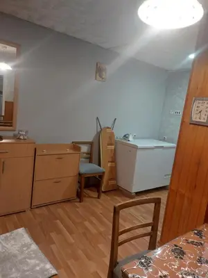 a kitchen with a sink and a bath tub at apartman Milica in Ruma