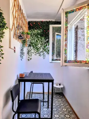 a table and two chairs in a room at Apartment Maria Belgrade Residence in Vračar (historical)