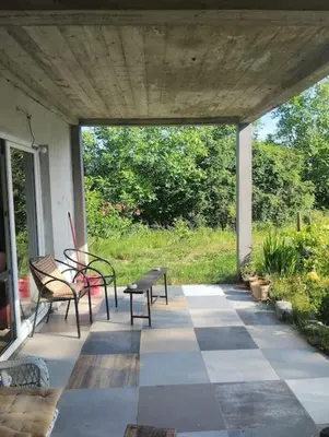 a patio with benches and a table and chairs at Villa Salter in Belgrade