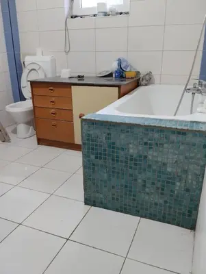 a bathroom with a tub and a sink and a toilet at Villa Salter in Belgrade