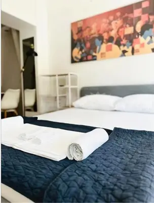 two beds in a hotel room with towels on them at Belgrade Central 532- Obilicev Venac in Belgrade