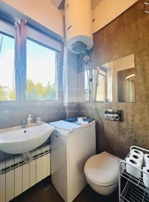 a bathroom with a toilet and a sink at Belgrade Central 532- Obilicev Venac in Belgrade