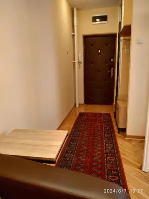 a room with a door and a rug in front of a door at Genex Gate in Belgrade