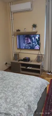 a flat screen tv in a living room at Genex Gate in Belgrade